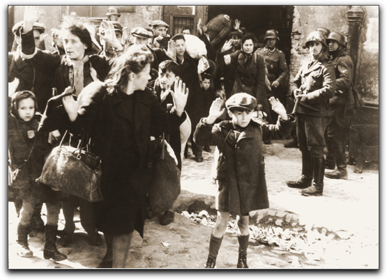 the boy with his hands raised being led out of the Warsaw Ghetto